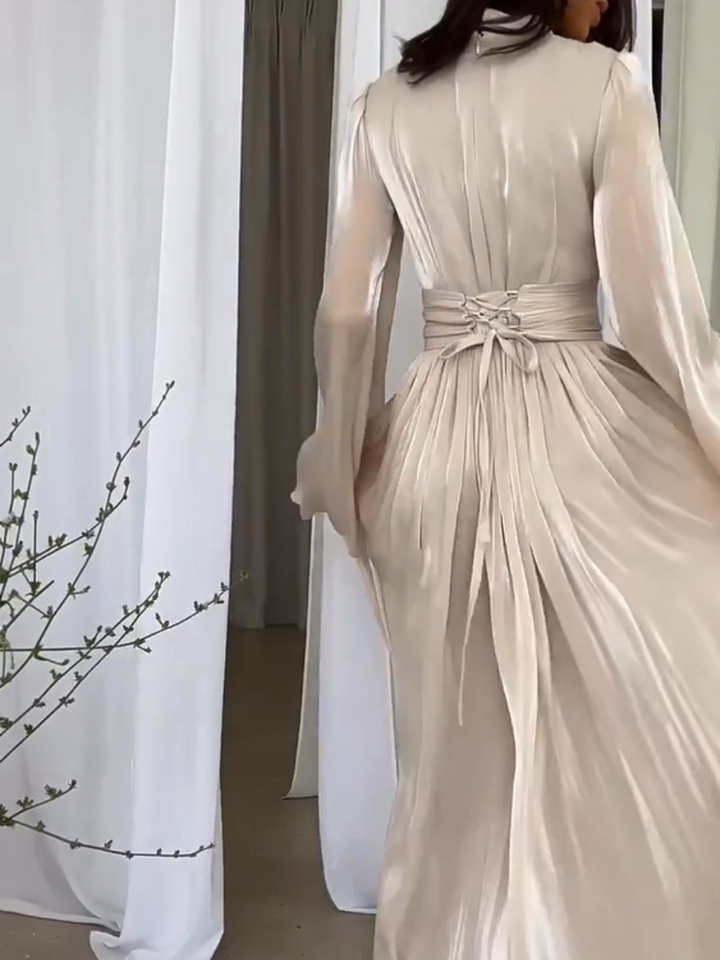 Comfortabele en elegante dames maxi jurk met strikceintuur, perfect als zomerjurk of voor feestelijke momenten.