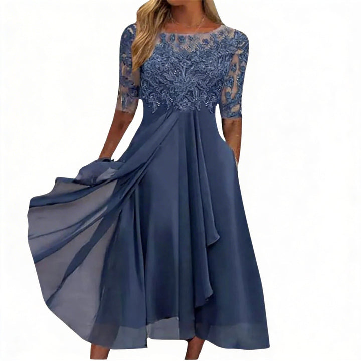 Elegante dames midi jurk met A-lijn rok, ronde hals en halve mouw. Perfect als blauwe feest- of avondjurk.