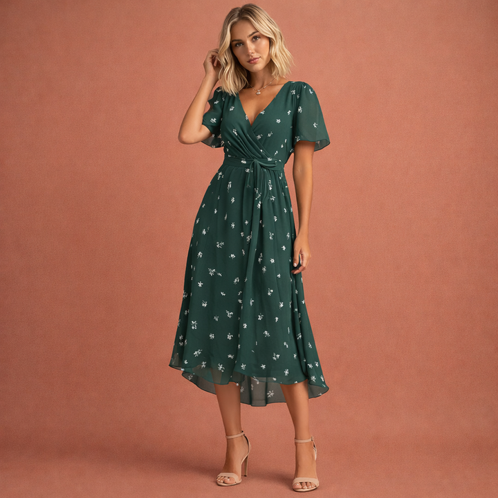 Feestelijke midi jurk met bloemenprint en korte mouwen voor dames. Stijlvolle dameskleding voor lente- of zomerfeestjes.