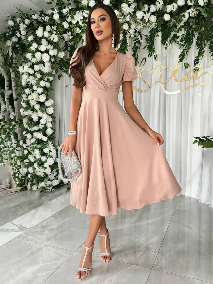 Stijlvolle dames lente midi jurk met pofmouwen, ideaal als avondjurk of elegante cocktailjurk.