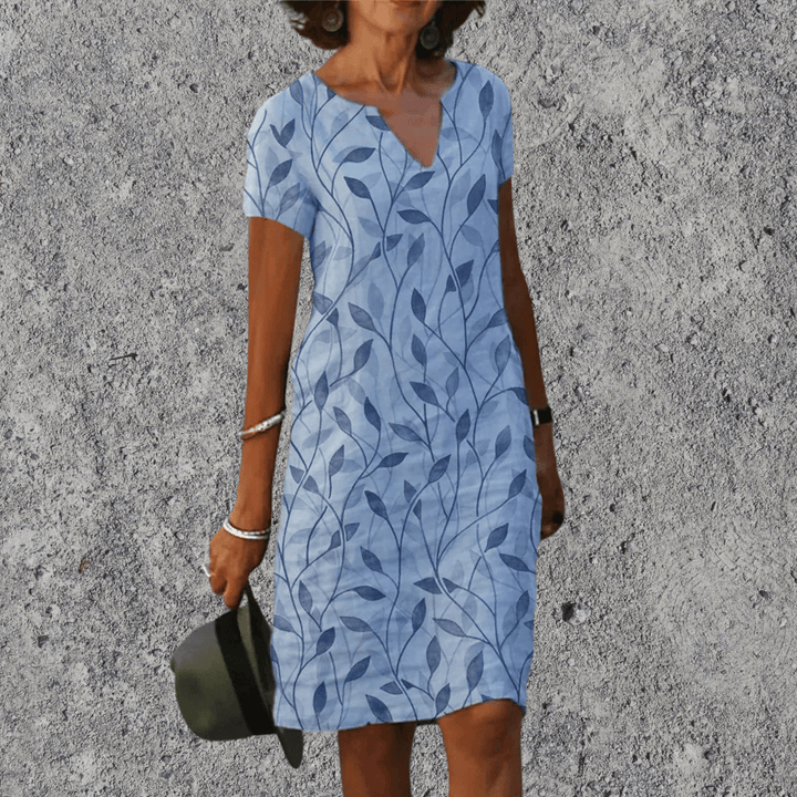 Elegante dames midi jurk met V-hals en korte mouwen. Perfect als comfortabele zomerjurk.