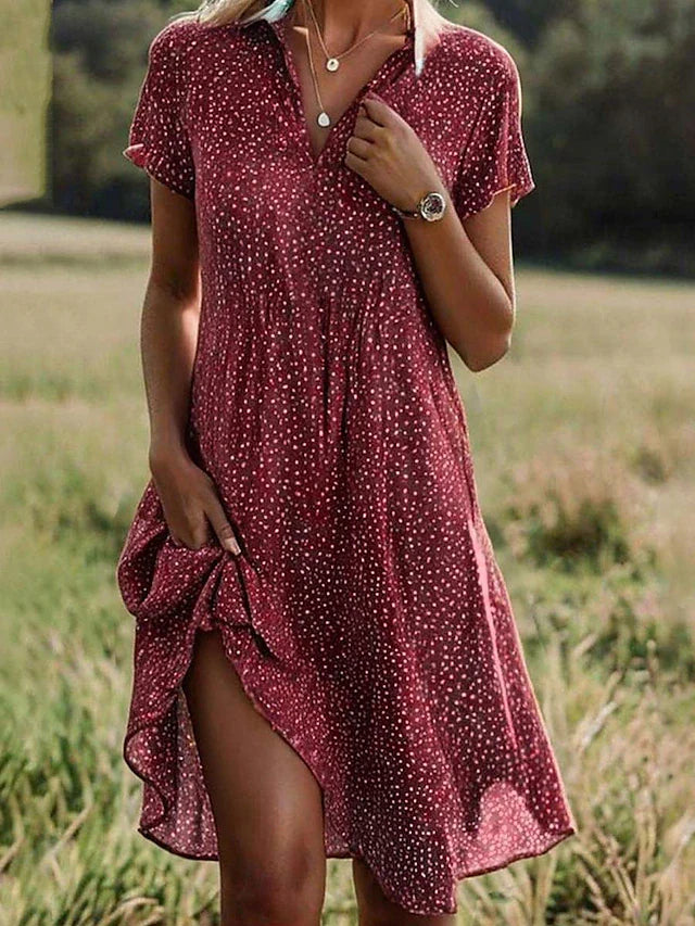 Veelzijdige dames midi-jurk met korte mouwen; luchtig en comfortabel voor een casual zomerlook of geklede outfit.
