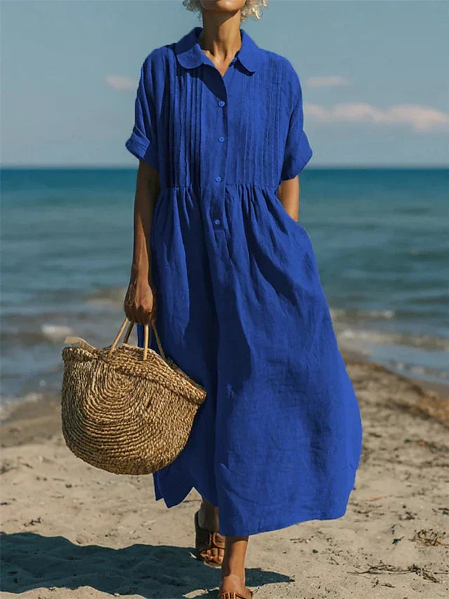 Casual-chique dames knoopjurk, midi model met vloeiende stof. Een comfortabele en elegante zomerjurk.