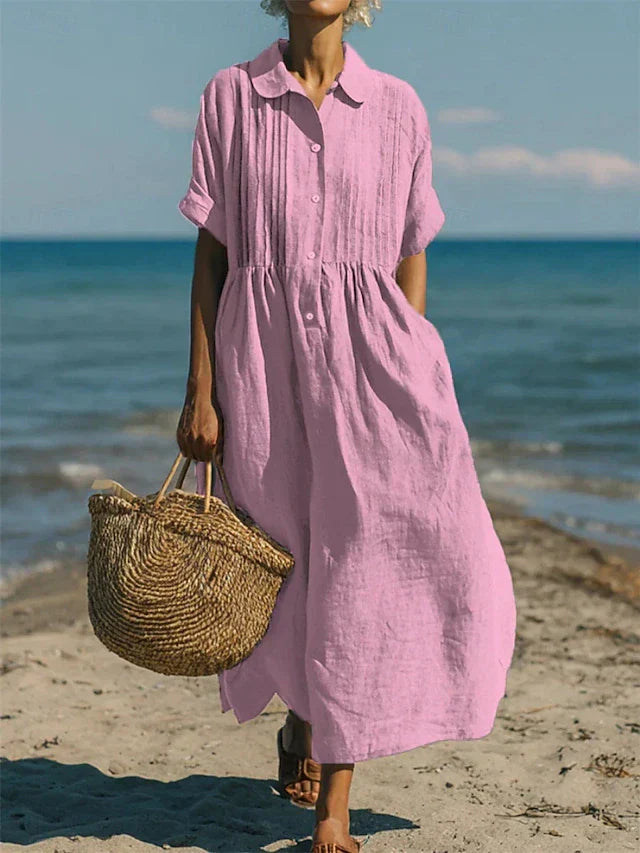 Vrouwen mode: vloeiende midi jurk met korte mouwen en complete knoopsluiting. Comfortabel en stijlvol.