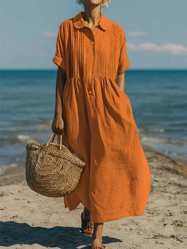 Lichte dames midi jurk, perfect als zomerjurk of lentejurk. Elegante overhemdjurk met knopen en korte mouwen.