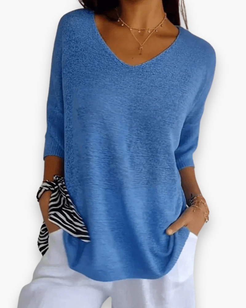 Modieuze losvallende dames V-hals top met 3/4 mouw, perfect voor een stijlvolle en comfortabele look.