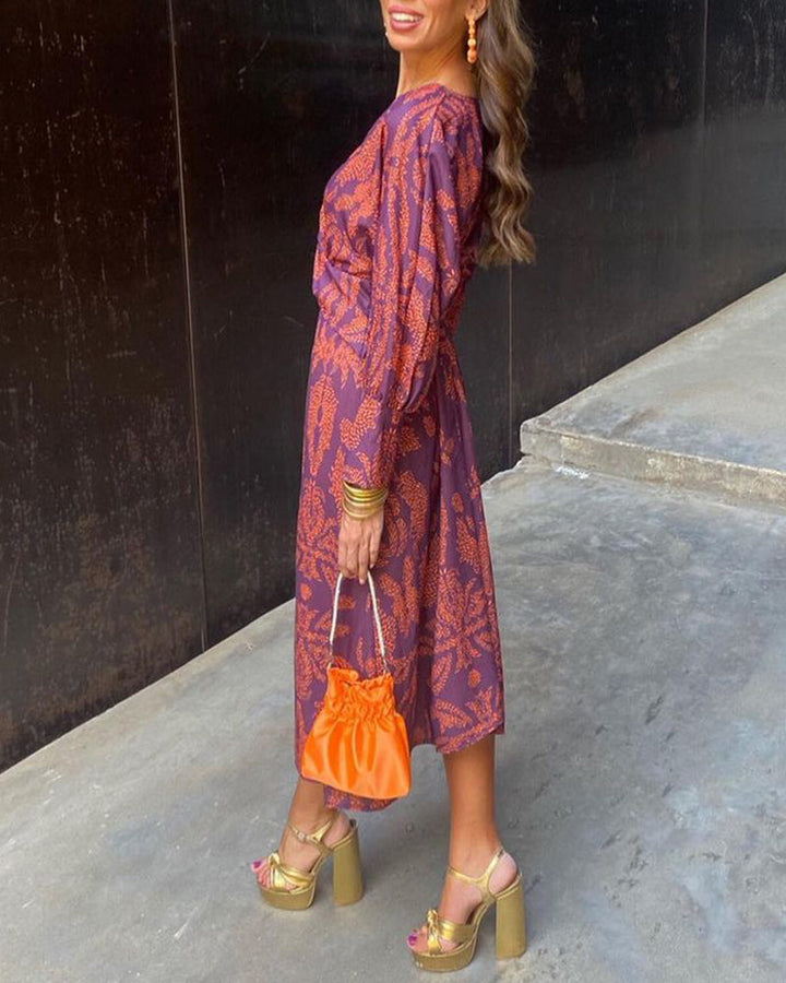 Modieuze dames wikkeljurk: elegante midi jurk met V-hals en lange mouwen, perfect voor vrouwenmode en feestjes.