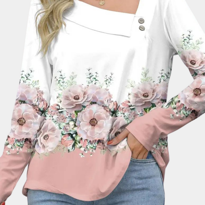"Elegante damesblouse met bloemenpatroon in bruin, asymmetrisch design, geschikt voor casual en formele gelegenheden."