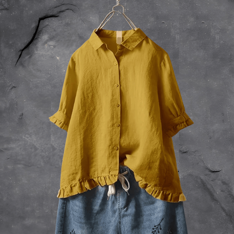 Vrolijke dames rucheblouse met losse pasvorm en korte mouwen, perfecte zomer top voor elke gelegenheid.