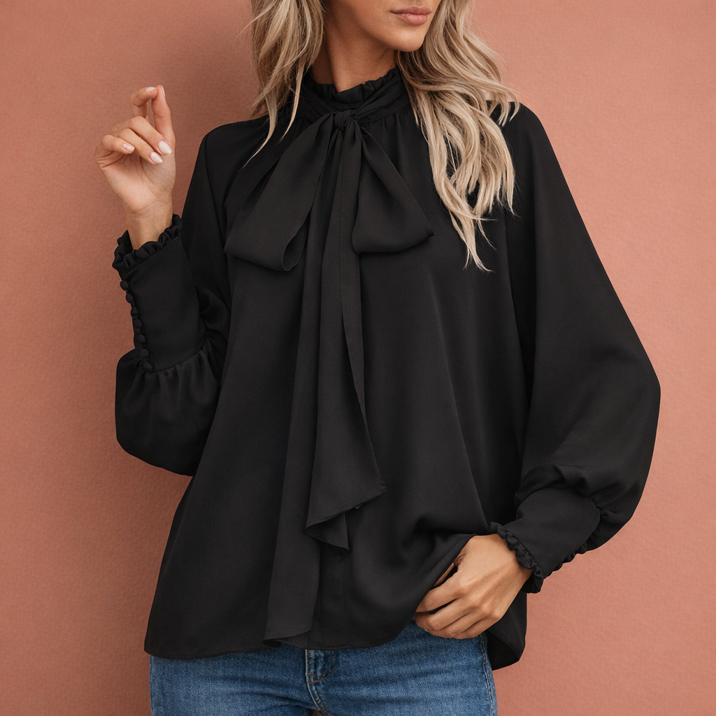 Elegante damesblouse met strik en losse pasvorm, ideaal voor zakelijke of casual chique look.