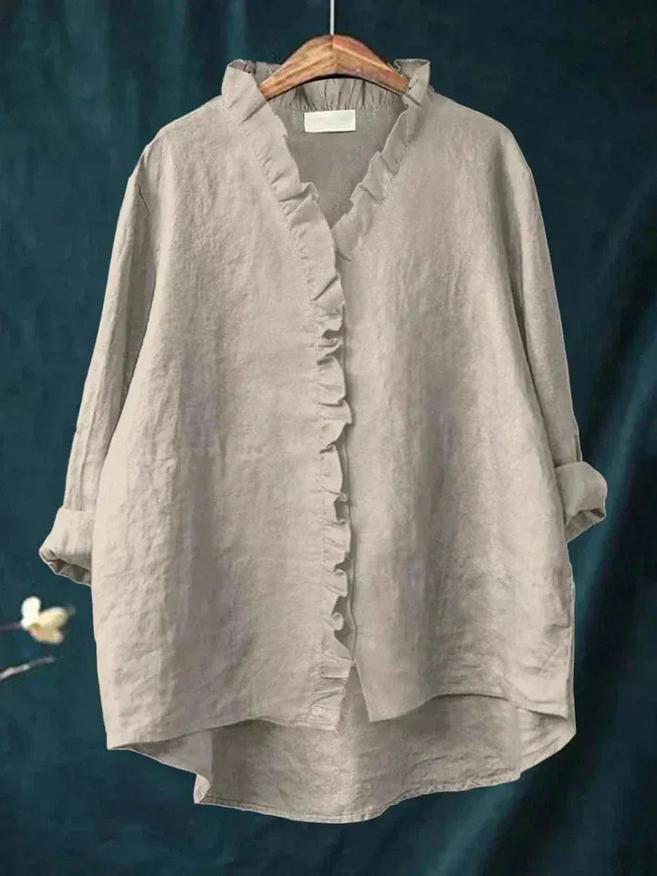 Comfortabele damesblouse met zachte stof, elegante V-hals, lange mouwen en delicate ruches voor casual stijl.