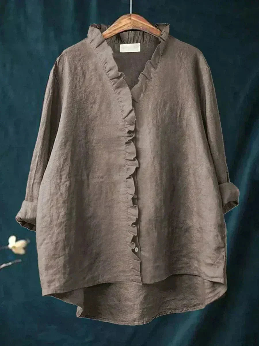 Oversized damesblouse met losvallende pasvorm, elegante V-hals en lange mouwen, ideaal voor comfort en stijl.