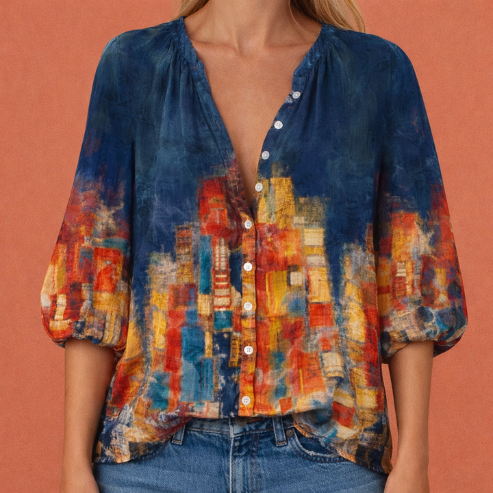 Elegante damesblouse met vrolijke print, V-hals en knoopsluiting. Perfect voor lente/zomer casual mode.