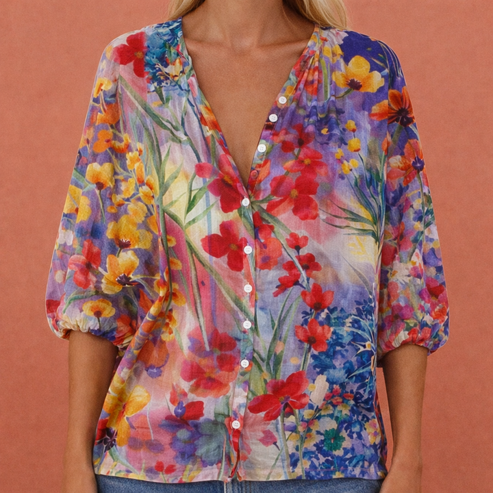 Casual geprinte dames top met V-hals en knoopsluiting. Comfortabele korte mouw blouse voor dagelijks gebruik.