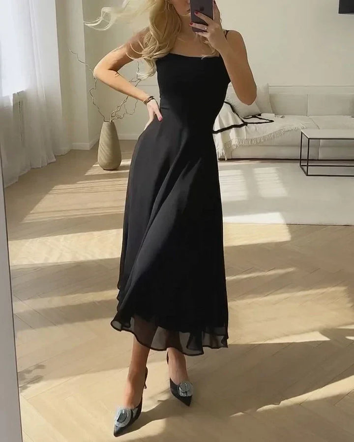 Stijlvolle midi damesjurk met vierkante hals, ideaal als feestjurk, zomerjurk of elegante casual outfit.