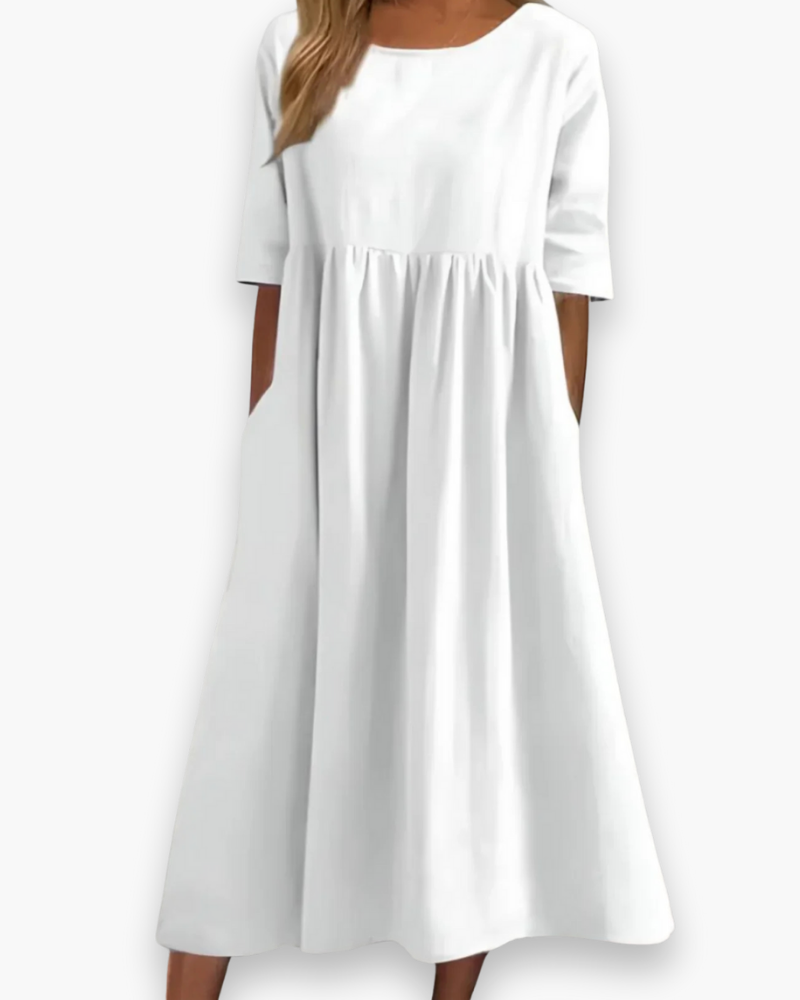 Comfortabele effen midi-jurk voor dames met praktische zakken, ideaal als casual zomerjurk.