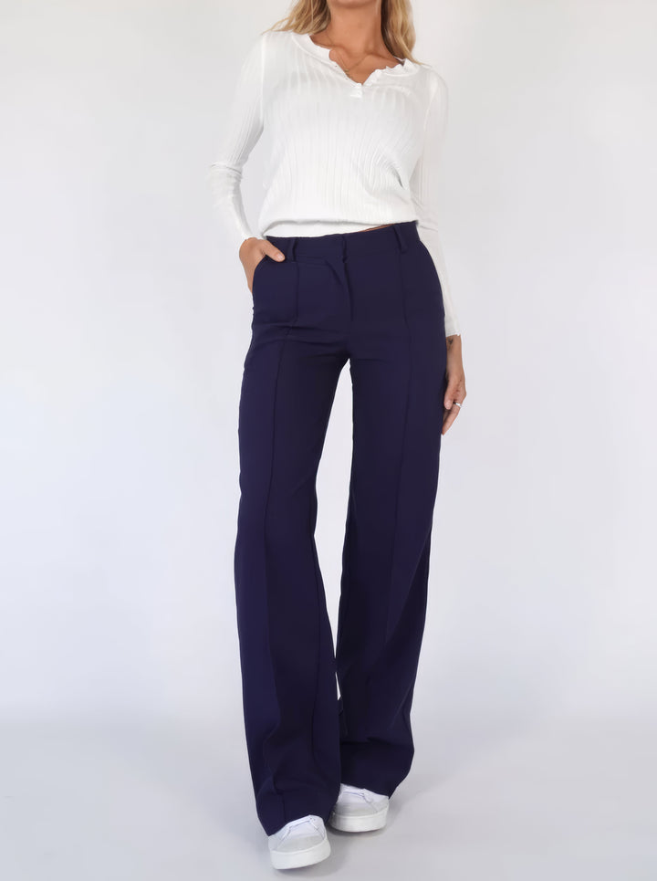 Elegante high-waist pantalon dames met rechte pijpen, zachte stretchstof, blinde ritssluiting; modieus en comfortabel.