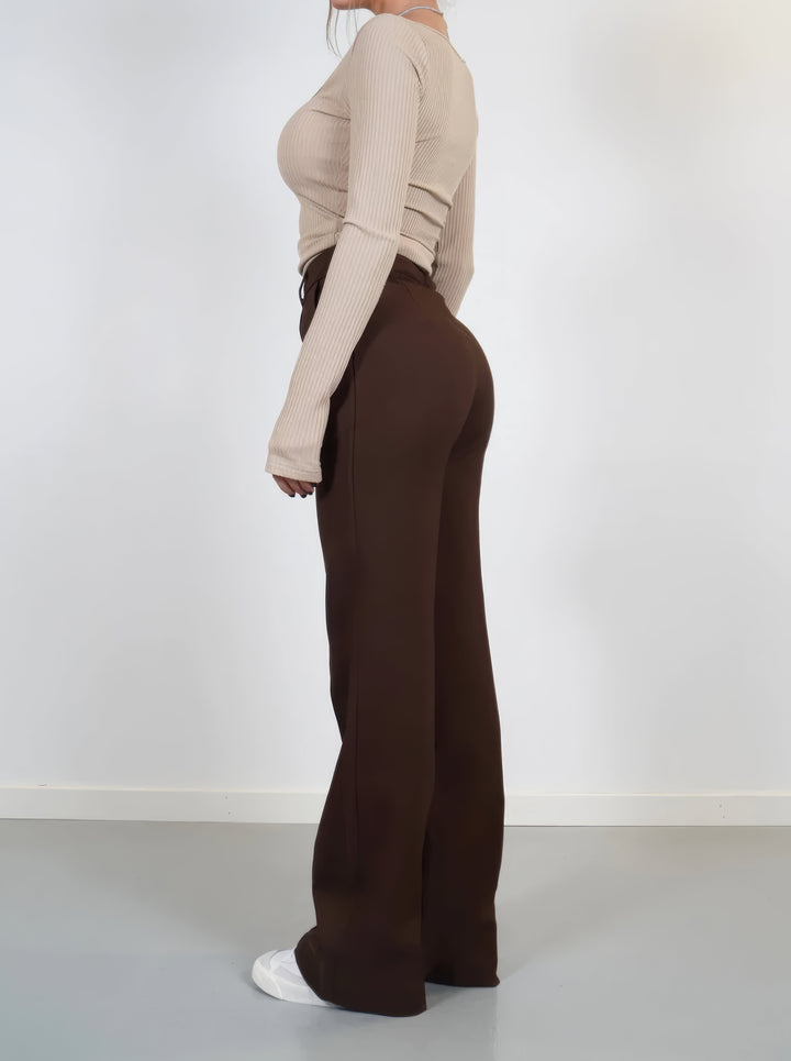 Elegante high-waist pantalon dames met rechte pijpen, zachte stretchstof, blinde ritssluiting; modieus en comfortabel.