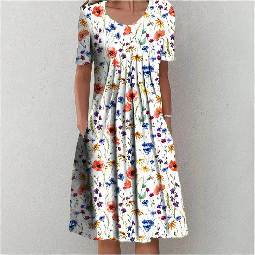 Stijlvolle dames jurk in blauw met bloemenprint, elegant en tijdloos.