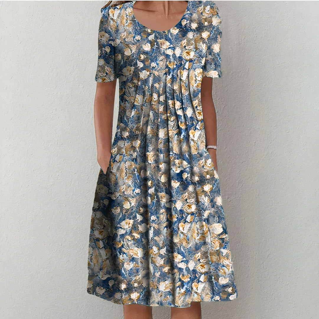 Stijlvolle dames jurk in blauw met bloemenprint, elegant en tijdloos.