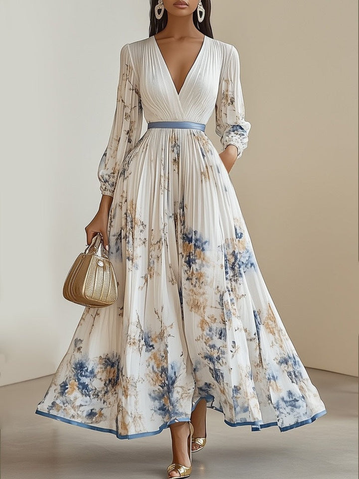 Stijlvolle lange damesjurk met levendige bloemenprint, perfect als elegante feestjurk of zomerse avondjurk.