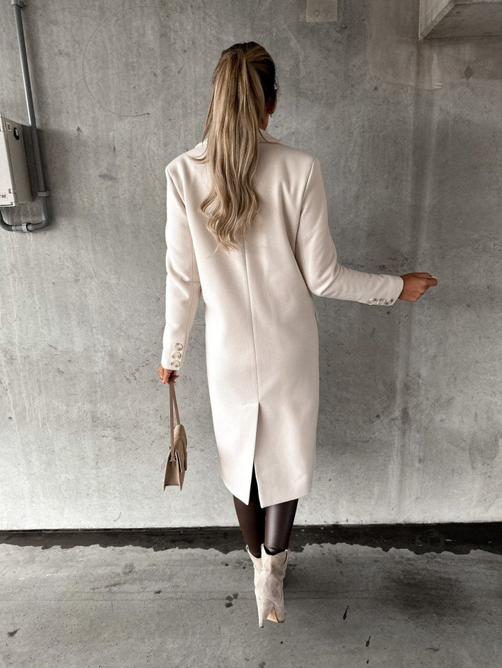 Essentiële elegante dames lange tussenjas, een chique en comfortabele aanvulling op elke garderobe.