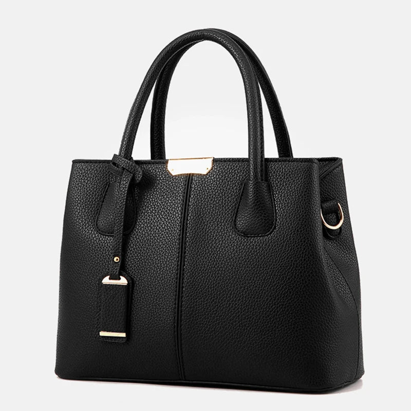 Elegante leren schoudertas voor dames, stijlvol en ruim, met verstelbare riem en verschillende kleurkeuzes.