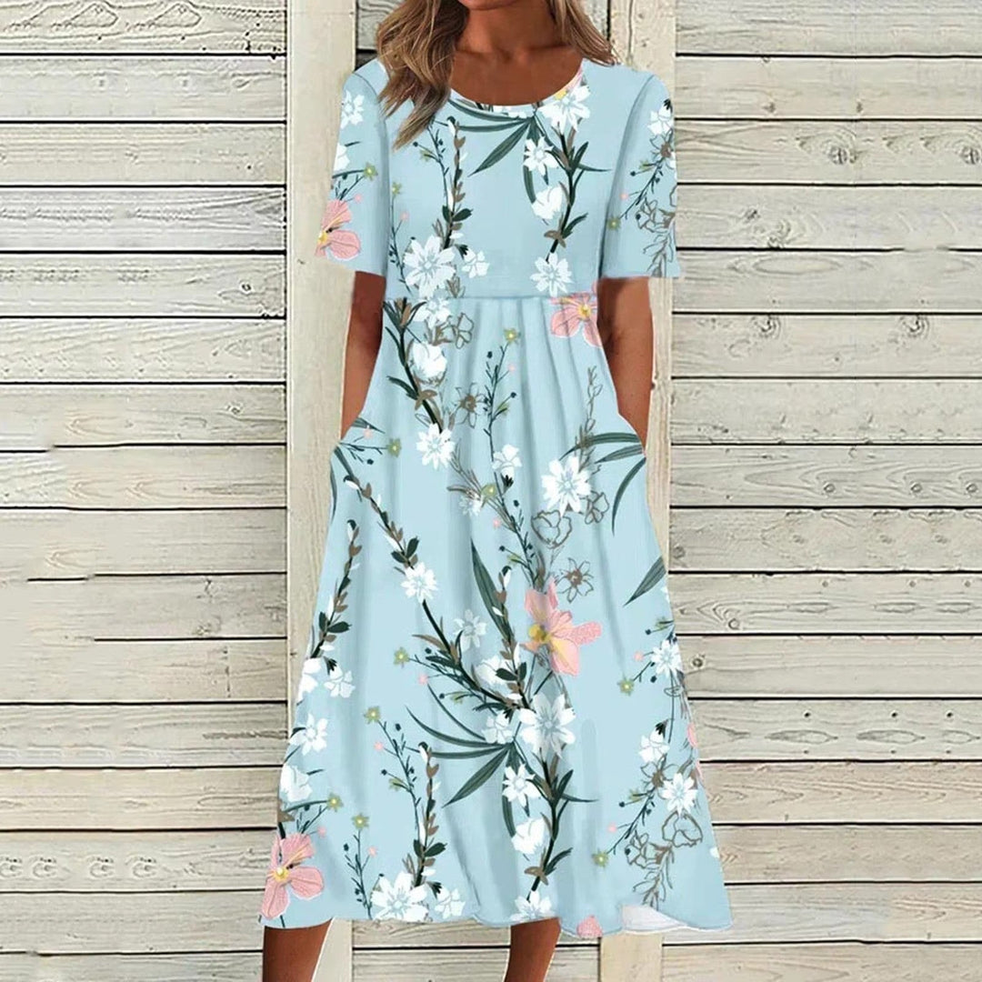 "Elegante Liva Midi-Jurk met luchtige stof en bloemenmotief; perfecte zomerse jurk voor elke gelegenheid."