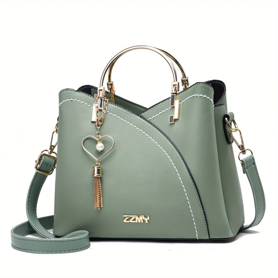 "Elegante luxe leren handtas met stijlvol kleurblokontwerp en kwastjes, perfect voor de moderne vrouw, frontaal gezien."
