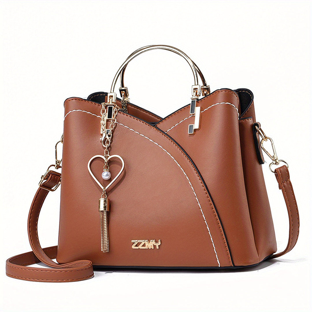 "Elegante luxe leren handtas met stijlvol kleurblokontwerp en kwastjes, perfect voor de moderne vrouw, frontaal gezien."