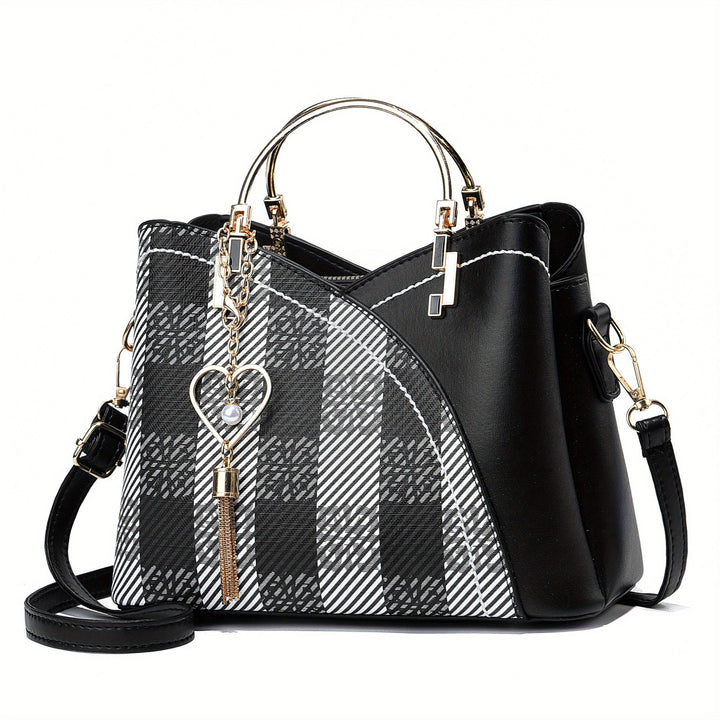 "Elegante luxe leren handtas met stijlvol kleurblokontwerp en kwastjes, perfect voor de moderne vrouw, frontaal gezien."