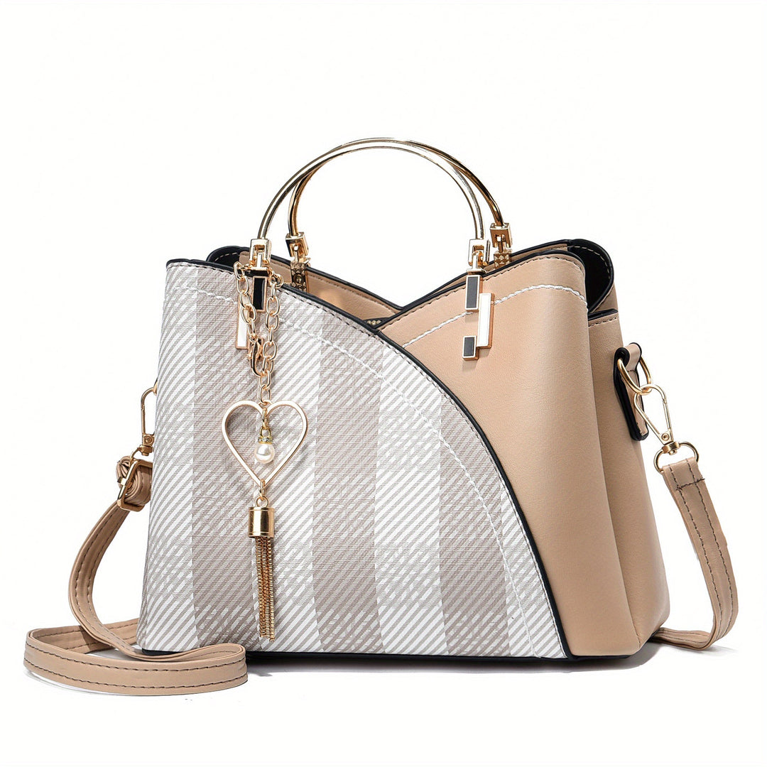 "Elegante luxe leren handtas met stijlvol kleurblokontwerp en kwastjes, perfect voor de moderne vrouw, frontaal gezien."