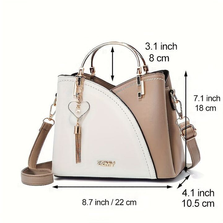 "Elegante luxe leren handtas met stijlvol kleurblokontwerp en kwastjes, perfect voor de moderne vrouw, frontaal gezien."