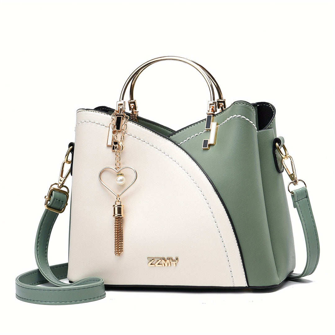 "Elegante luxe leren handtas met stijlvol kleurblokontwerp en kwastjes, perfect voor de moderne vrouw, frontaal gezien."