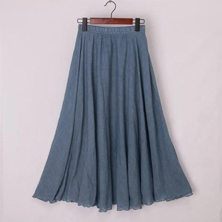 "Elegante maxi-rok van zachte katoen in een neutrale tint, met hoge taille, perfect voor dagelijks en avondgebruik."