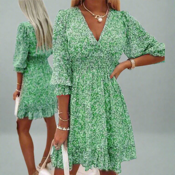 Stijlvolle dames midi zomerjurk met diepe V-hals. Perfect voor elegante zomeroutfits en casual gebruik.