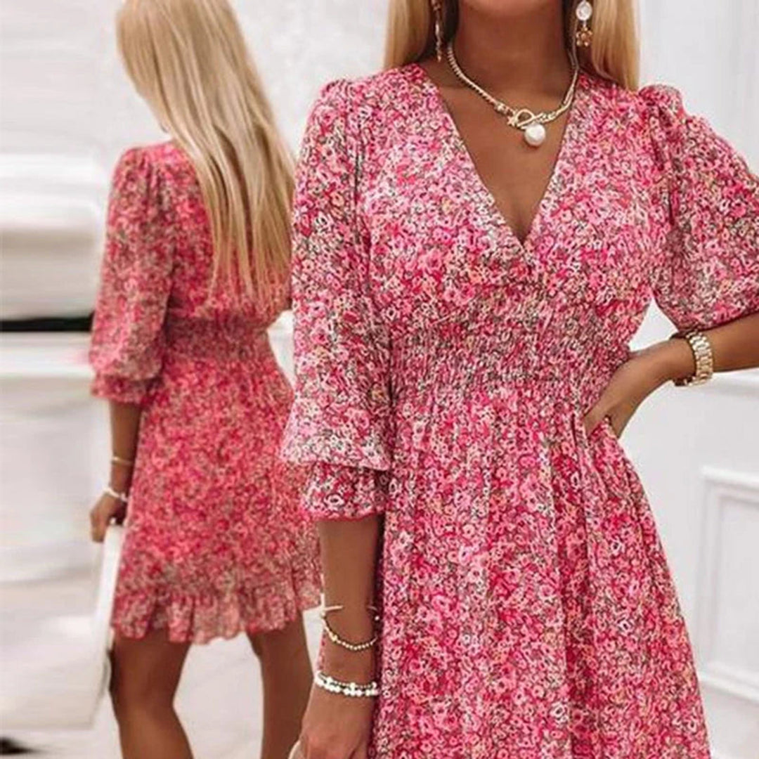 Elegante midi jurk dames met V-hals en korte mouwen. Geschikt als zomeroutfit, casual jurk of feestjurk.