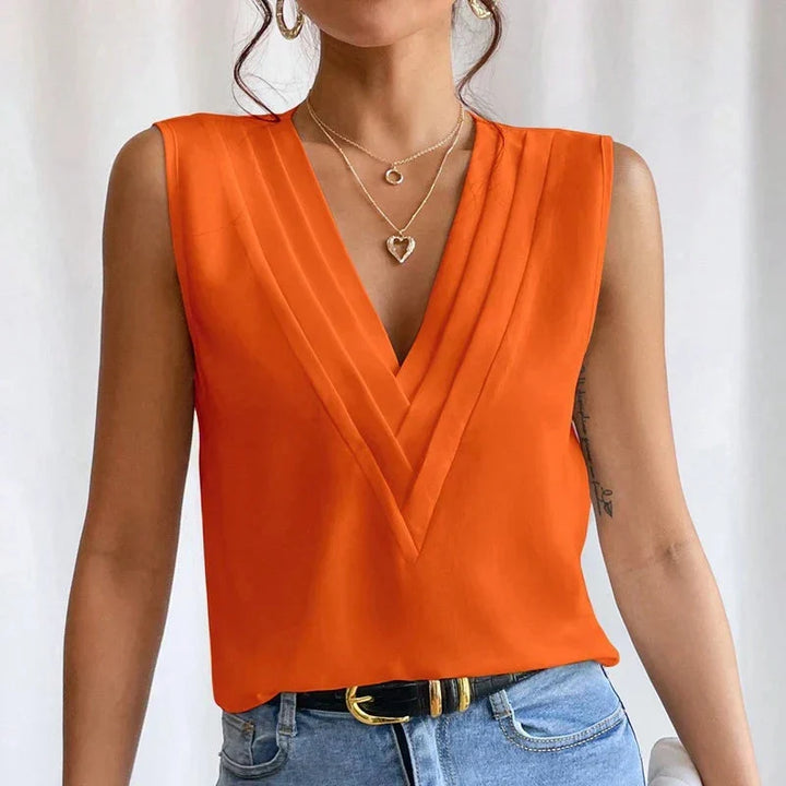 Moderne mouwloze V-hals blouse voor vrouwen, combineert elegantie met draagcomfort.