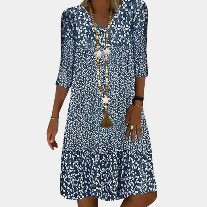 Elegante Paloma midi-jurk dames met V-hals, A-lijn, driekwart mouwen en luchtige print, ideaal voor zomerse dagen.