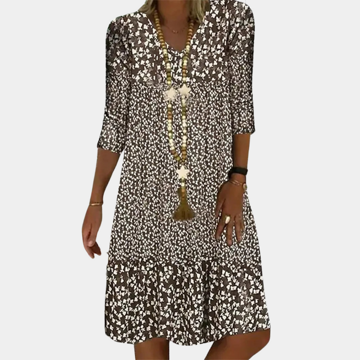 Elegante Paloma midi-jurk dames met V-hals, A-lijn, driekwart mouwen en luchtige print, ideaal voor zomerse dagen.