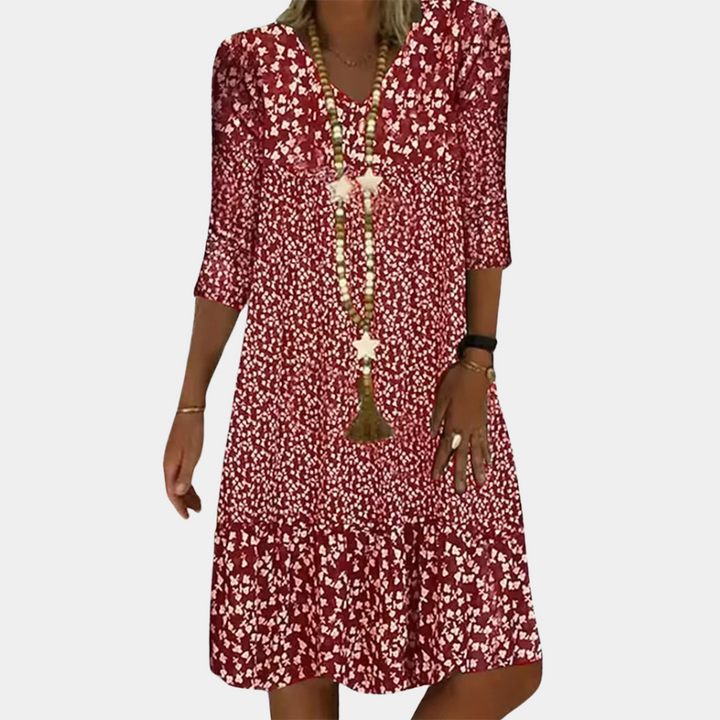 Elegante Paloma midi-jurk dames met V-hals, A-lijn, driekwart mouwen en luchtige print, ideaal voor zomerse dagen.