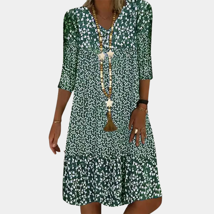 Elegante Paloma midi-jurk dames met V-hals, A-lijn, driekwart mouwen en luchtige print, ideaal voor zomerse dagen.