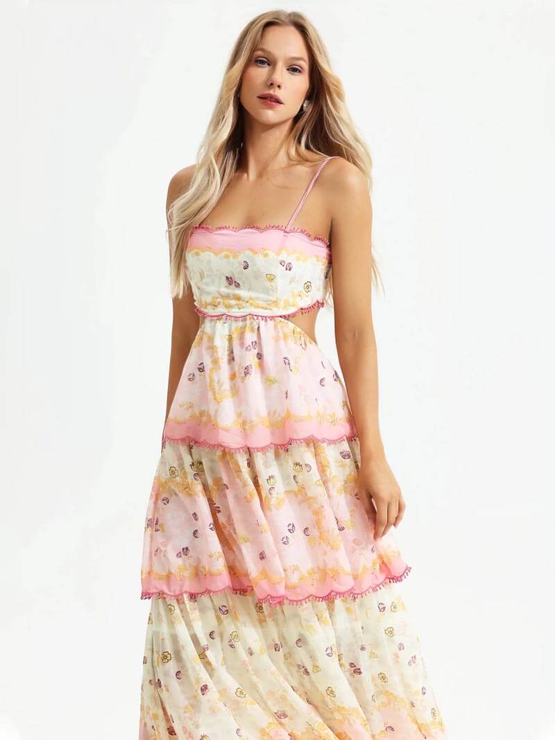 Trendbewuste damesjurk: roze maxi-jurk met modieuze ruches, elegante borduursels en zomerse uitstraling.