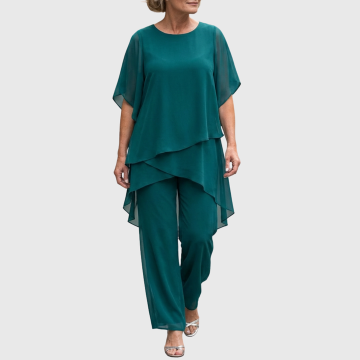 Complete tweedelige dames set: elegante top met drapering en wijde palazzo broek. Comfortabel en chic.