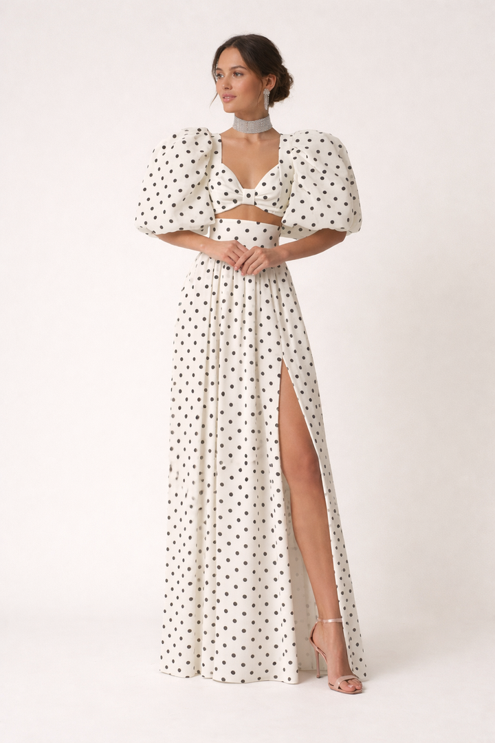 Elegante tweedelige dames topset met pofmouwen en een zwierige maxirok, perfect voor feestjes.