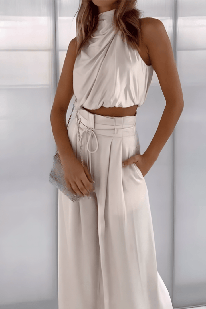 Effen gekleurde tweedelige set dames, elegante mouwloze top & wijdvallende broek, stijlvol en comfortabel.