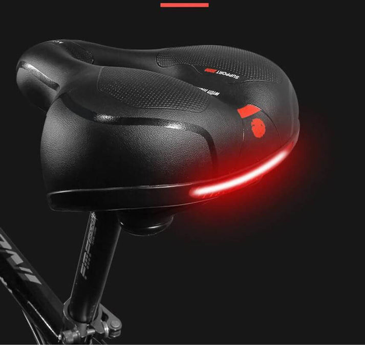 Rood ergonomisch fietszadel, schokabsorberend en ademend, voor pijnvrije en comfortabele ritten.