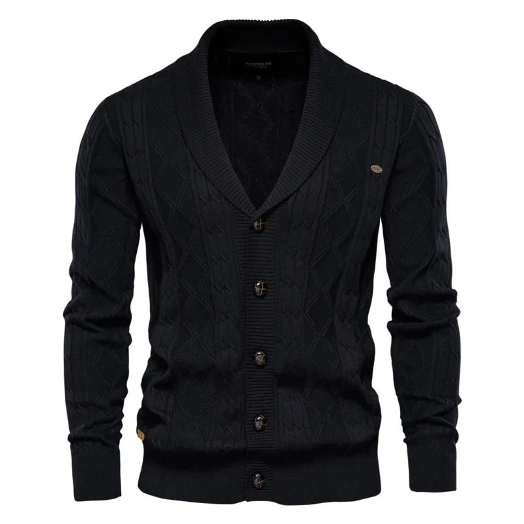 Comfortabel gebreid herenvest met sjaalkraag en knoopsluiting. Het ruitpatroon maakt dit vest perfect voor herfst/winter.