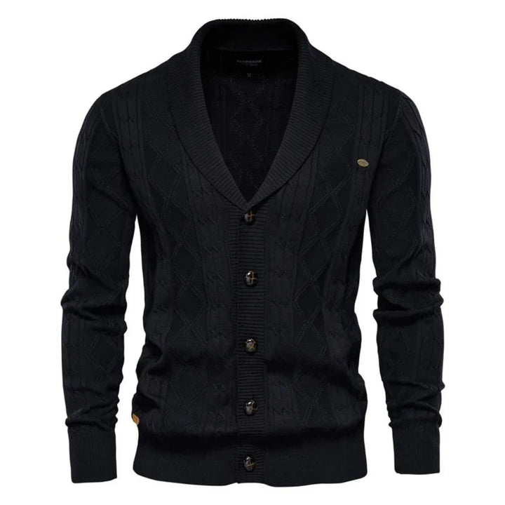 Comfortabel gebreid herenvest met sjaalkraag en knoopsluiting. Het ruitpatroon maakt dit vest perfect voor herfst/winter.