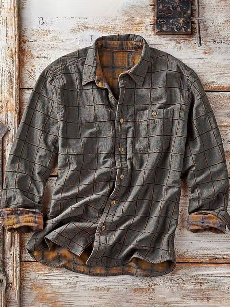 Grijs geruit herenshirt met lange mouw en ruitpatroon. Modieus overshirt met borstzak, perfect voor casual look.